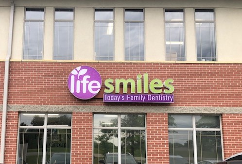 Life Smiles Electrical Sign