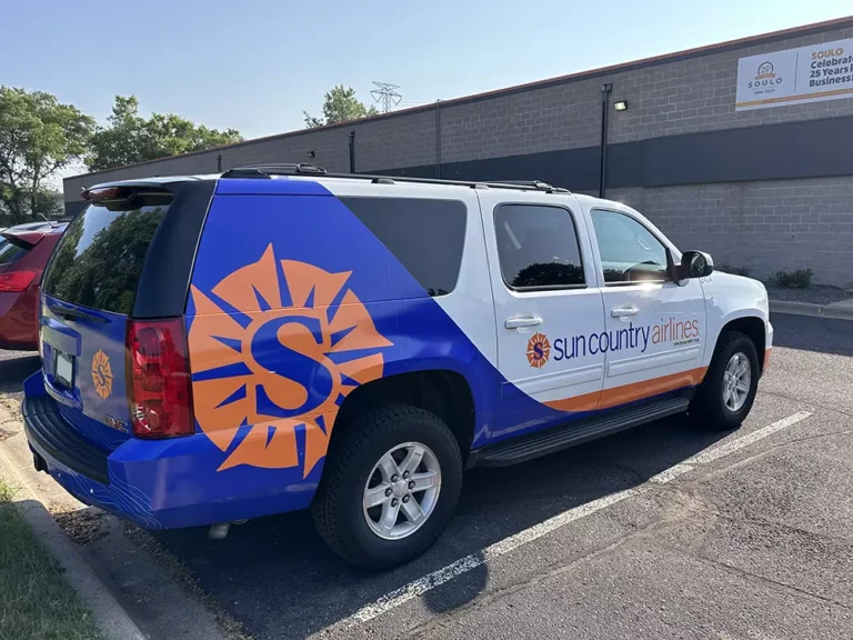 Sun Country van wrap passenger side from rear